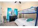 This bedroom features a bunk bed, a ceiling fan, and a window with blue curtains at 2520 Cross Springs Dr, Cumming, GA 30041