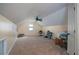 Spacious bonus room with neutral walls, carpet floors, ceiling fan, and abundant natural light at 2520 Cross Springs Dr, Cumming, GA 30041