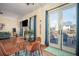 Living room with hardwood floors, glass doors to the patio, and dining space at 2520 Cross Springs Dr, Cumming, GA 30041