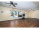 Large living room with hardwood floors, neutral paint, and a view of the pool through the window at 2520 Cross Springs Dr, Cumming, GA 30041