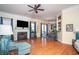 Inviting living room with hardwood floors, fireplace, and seamless access to the dining area at 2520 Cross Springs Dr, Cumming, GA 30041