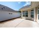 Landscaped backyard with a concrete patio, adjacent to another house at 4902 Pleasantry Way, Acworth, GA 30101