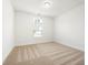 Bedroom with neutral carpeting, a window providing ample natural light, and a ceiling light fixture at 4902 Pleasantry Way, Acworth, GA 30101