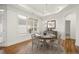 Dining area features hardwood floors, chandelier and view to backyard at 4902 Pleasantry Way, Acworth, GA 30101
