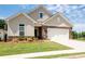 Charming single-Gathering home featuring stone accents, a two-car garage, and a beautifully landscaped front yard at 4902 Pleasantry Way, Acworth, GA 30101