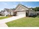 Charming single-Gathering home featuring stone accents, a two-car garage, and a beautifully landscaped front yard at 4902 Pleasantry Way, Acworth, GA 30101