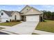 Charming home with a well-kept lawn, long driveway, and lovely stone accents at 4902 Pleasantry Way, Acworth, GA 30101