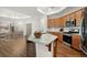 Kitchen with stainless steel appliances, granite countertop island and view of dining area at 4902 Pleasantry Way, Acworth, GA 30101