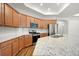 Kitchen featuring stainless steel appliances, granite counters and wood cabinets at 4902 Pleasantry Way, Acworth, GA 30101