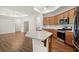 Kitchen with stainless steel appliances, granite countertop island and view of dining area at 4902 Pleasantry Way, Acworth, GA 30101