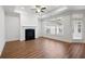 Bright living room with fireplace, large window, ceiling fan, and access to the porch at 4902 Pleasantry Way, Acworth, GA 30101