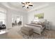 Staged main bedroom featuring a tray ceiling, neutral decor, and an inviting atmosphere at 4902 Pleasantry Way, Acworth, GA 30101