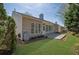 A spacious backyard featuring a concrete patio, offering a seamless transition from indoor to outdoor living spaces at 6560 Waveland Dr, Cumming, GA 30040