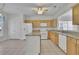Bright kitchen featuring granite countertops and white appliances at 6560 Waveland Dr, Cumming, GA 30040