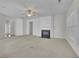 Cozy living room with fireplace and large windows at 6560 Waveland Dr, Cumming, GA 30040