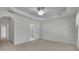 Spacious main bedroom with tray ceiling and ensuite bathroom at 6560 Waveland Dr, Cumming, GA 30040