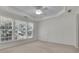 Bright main bedroom with large windows overlooking landscaped yard at 6560 Waveland Dr, Cumming, GA 30040