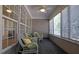 Inviting sunroom with wicker seating, multiple windows, and plenty of natural light at 6560 Waveland Dr, Cumming, GA 30040