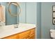 Cozy bathroom vanity with a gold mirror and a white sink at 1439 Evers Pl, Lawrenceville, GA 30043