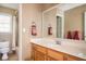 Bathroom vanity with a large mirror and a tub in the corner at 1439 Evers Pl, Lawrenceville, GA 30043