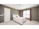 Cozy bedroom with natural light, neutral colors, and comfortable furnishings at 1439 Evers Pl, Lawrenceville, GA 30043