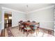 Formal dining room featuring a chandelier, classic rug, and seating for six at 1439 Evers Pl, Lawrenceville, GA 30043