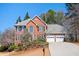 Beautiful two-story brick home with a two-car garage and lovely landscaping at 1439 Evers Pl, Lawrenceville, GA 30043