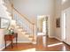 Inviting foyer features hardwood floors, staircase, and a view into another room at 1439 Evers Pl, Lawrenceville, GA 30043