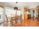 Eat-in kitchen area with hardwood floors, a dining table set, and natural lighting at 1439 Evers Pl, Lawrenceville, GA 30043