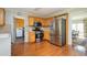 Bright kitchen featuring stainless steel appliances, wood cabinets, and hardwood floors at 1439 Evers Pl, Lawrenceville, GA 30043