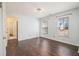 Bedroom with hardwood floors, two windows, and neutral walls at 2050 Federal Rd, Roswell, GA 30075