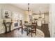 Charming dining area with hardwood floors, stylish lighting, and adjacent kitchen at 2050 Federal Rd, Roswell, GA 30075