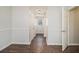 Hallway featuring hardwood floors and neutral-colored walls and trim at 2050 Federal Rd, Roswell, GA 30075