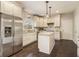 Modern kitchen with stainless steel fridge, granite countertops, and ample cabinet space at 2050 Federal Rd, Roswell, GA 30075