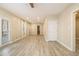 Spacious living room with modern wood-look floors, recessed lighting and ample natural light at 2050 Federal Rd, Roswell, GA 30075