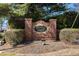 Brick community sign for Bristol Oaks surrounded by lush greenery and landscaping at 2050 Federal Rd, Roswell, GA 30075