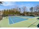 Well-maintained tennis courts with lush landscaping, offering a great amenity for active residents at 2050 Federal Rd, Roswell, GA 30075