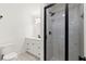 Modern bathroom with a glass-enclosed shower, patterned tile floor, and white vanity at 8700 Mount Rushmore Dr, Alpharetta, GA 30022