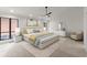 Modern bedroom featuring a neutral color palette, large windows, and a ceiling fan at 8700 Mount Rushmore Dr, Alpharetta, GA 30022