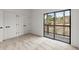 Bedroom featuring soft carpet, a closet, and balcony access at 8700 Mount Rushmore Dr, Alpharetta, GA 30022