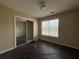 This bedroom with hardwood floors also offers a sliding door closet at 2074 Green Gate Pl, Grayson, GA 30017