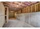 Unfinished basement boasts exposed insulation, concrete walls, and an open layout at 3870 Ivy Cottage Dr, Snellville, GA 30039