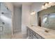 Elegant bathroom with dual vanity, marble floors, and a glass-enclosed shower at 3870 Ivy Cottage Dr, Snellville, GA 30039