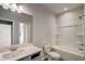 Bright bathroom featuring a shower-tub combo, white toilet, and sleek vanity at 3870 Ivy Cottage Dr, Snellville, GA 30039