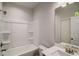 A bathroom with a shower-tub combo, a single sink, and a white finish at 3870 Ivy Cottage Dr, Snellville, GA 30039