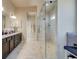 A luxurious bathroom with granite counters, a spacious walk-in shower, and stylish fixtures at 3870 Ivy Cottage Dr, Snellville, GA 30039