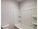 Clean bathroom features white tub and shower combo at 3870 Ivy Cottage Dr, Snellville, GA 30039