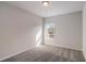 Cozy bedroom with gray carpet, soft lighting, and a serene view from the window at 3870 Ivy Cottage Dr, Snellville, GA 30039