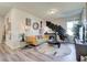 Cozy bonus room featuring eclectic decor, a comfortable sofa, and a relaxing atmosphere at 3870 Ivy Cottage Dr, Snellville, GA 30039