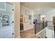 Upstairs hallway with hardwood flooring, decorative ladder and access to other rooms at 3870 Ivy Cottage Dr, Snellville, GA 30039